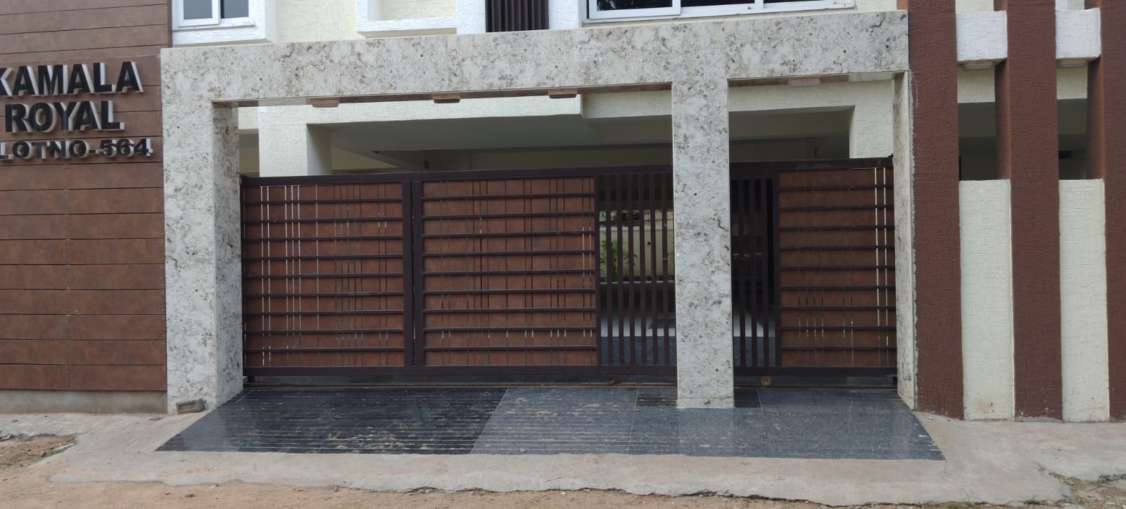Residential entrance gate with wood and metal detailing